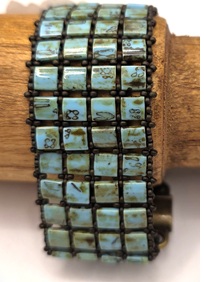 Turquoise tila's met zwart 16cm